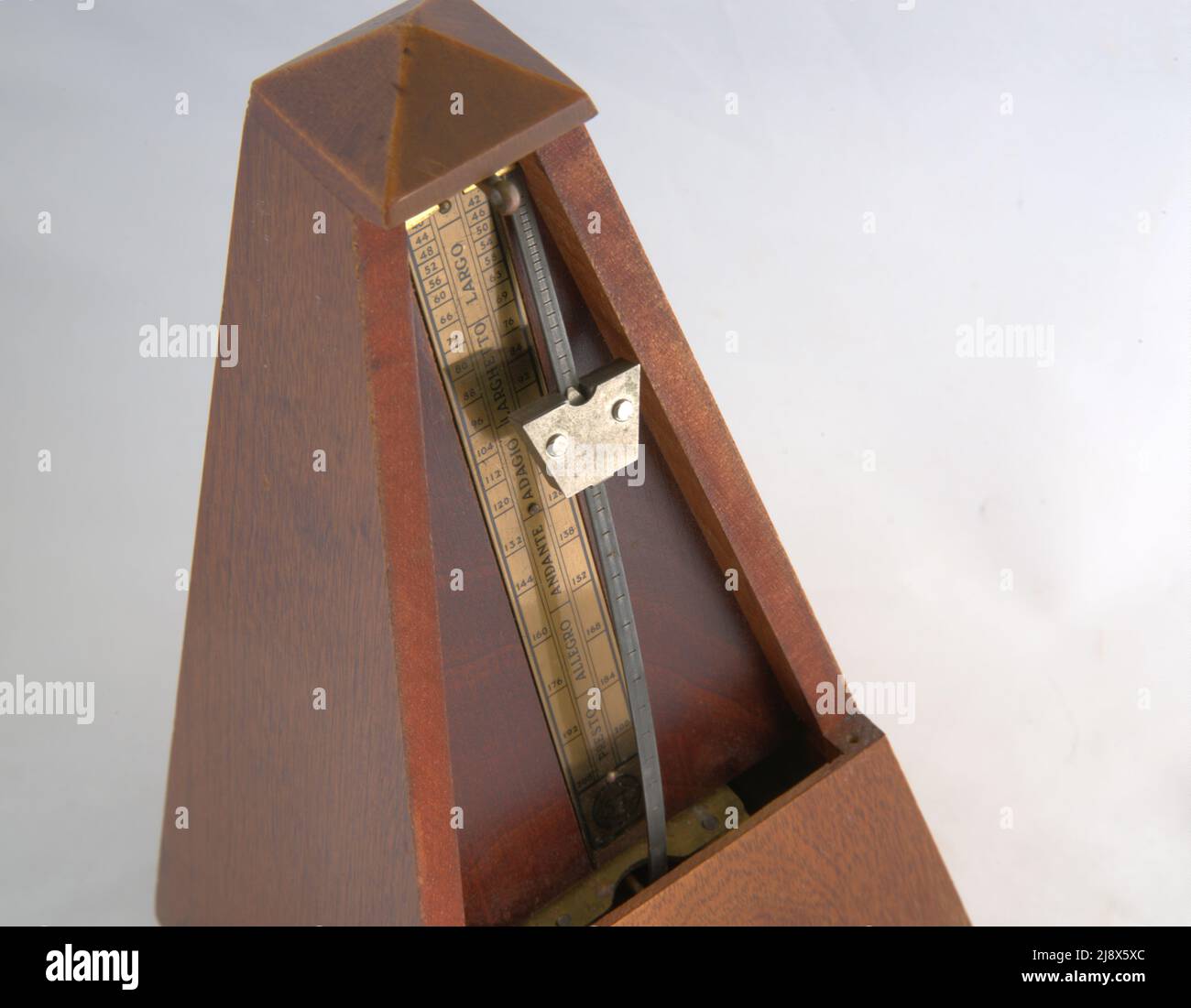 retro metronome for creating a steady beat of rhythm in music, Stock Photo
