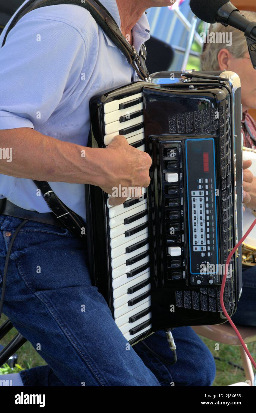 Accordion player - right hand onthe molodion keyboard.. Stock Photo