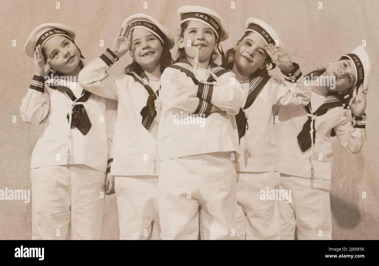 Dionne quintuplets in sailor outfits - The Dionne quintuplets are the first quintuplets known to have survived their infancy  ca.  1940 Stock Photo