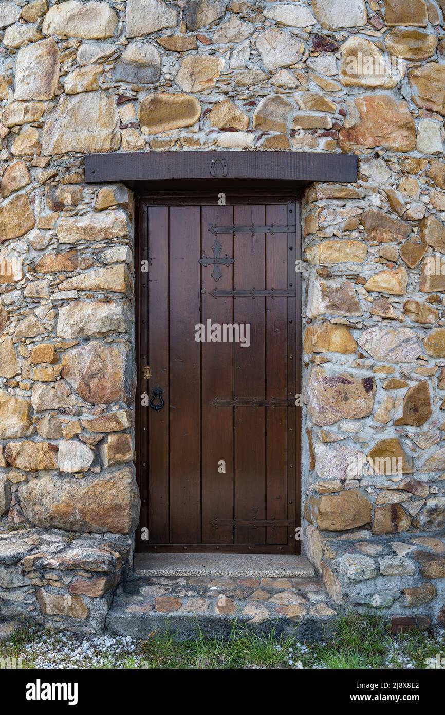 Ancient wooden door in stone wall Stock Photo - Alamy