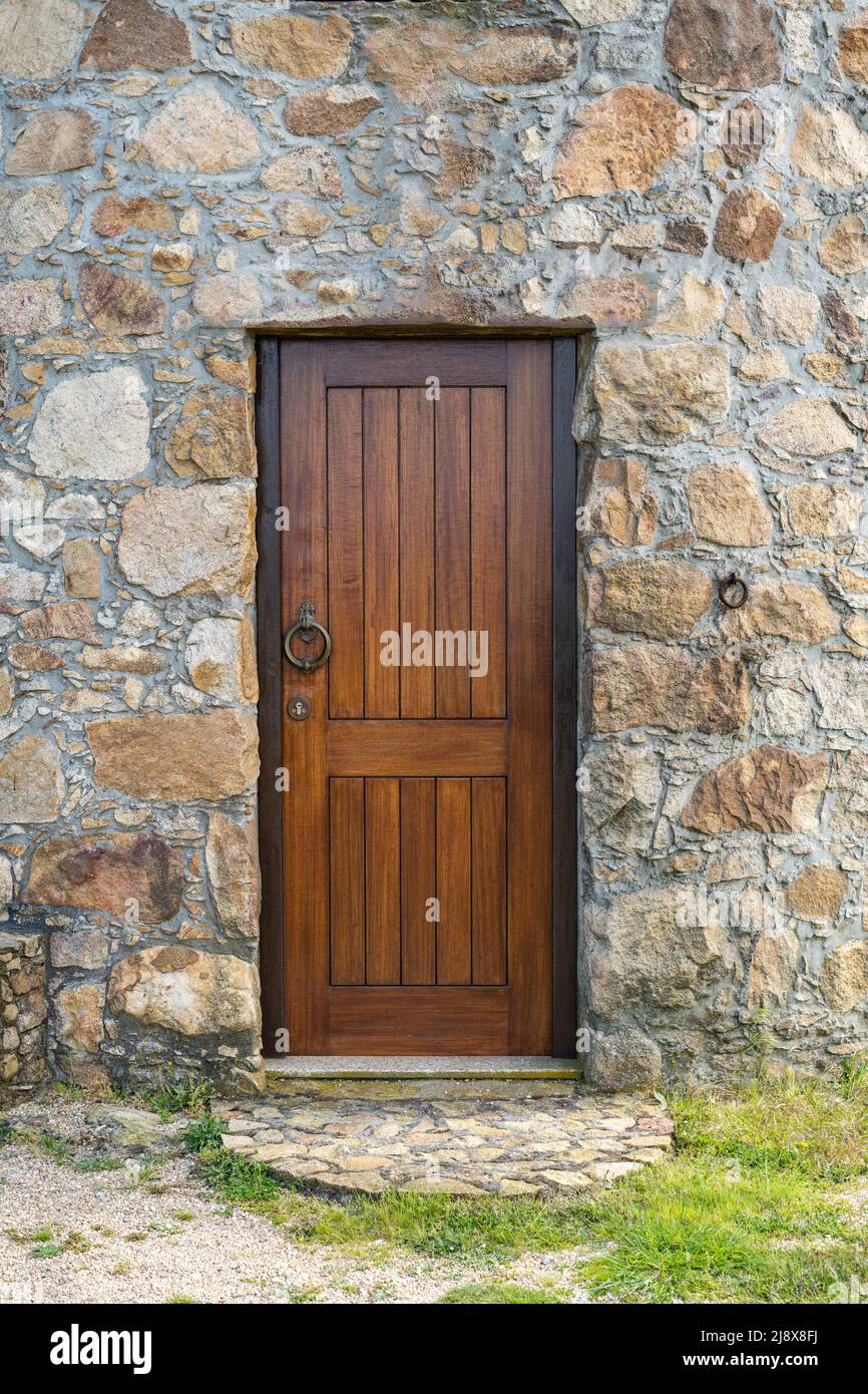 Ancient wooden door in stone wall Stock Photo - Alamy