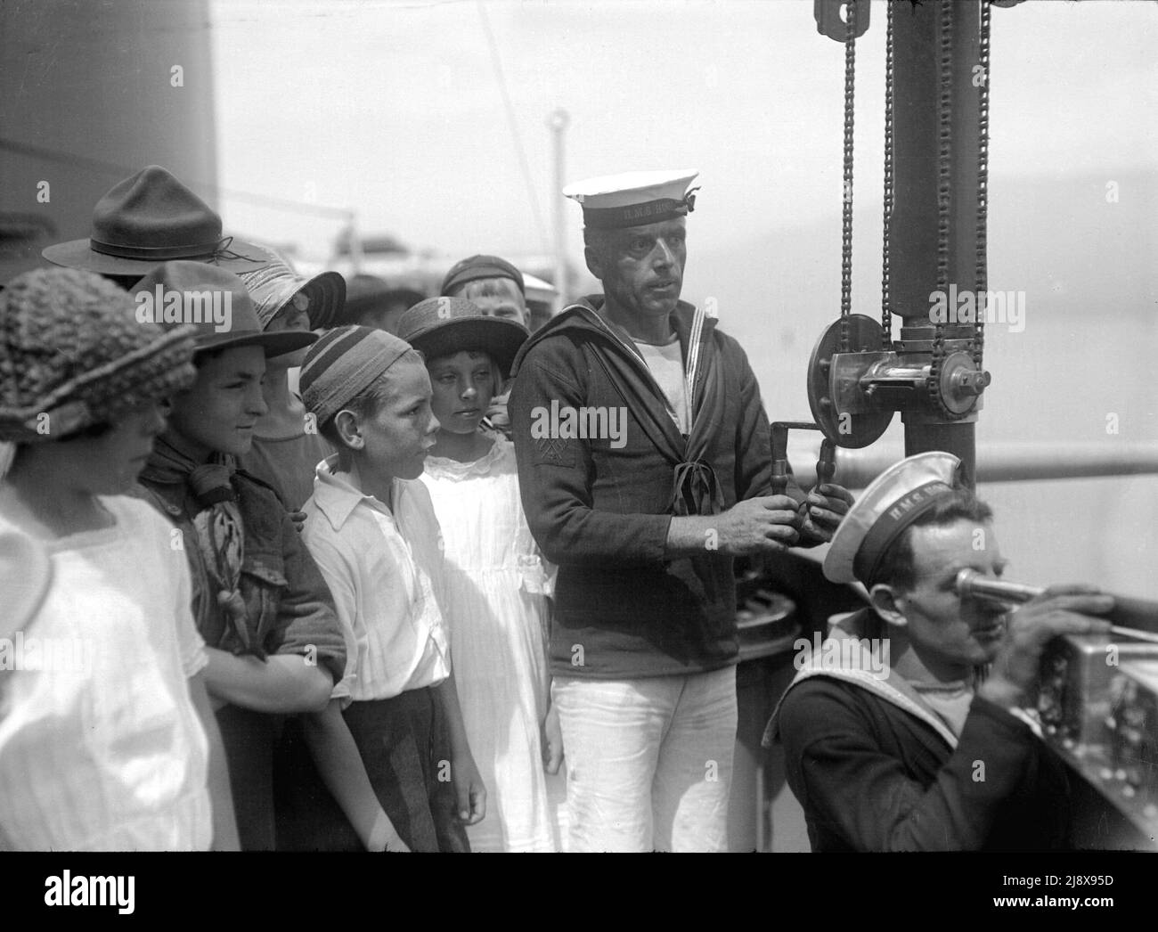 Children aboard HMS Hood at Vancouver. Signalers demonstrate their jobs  ca.  1924 Stock Photo