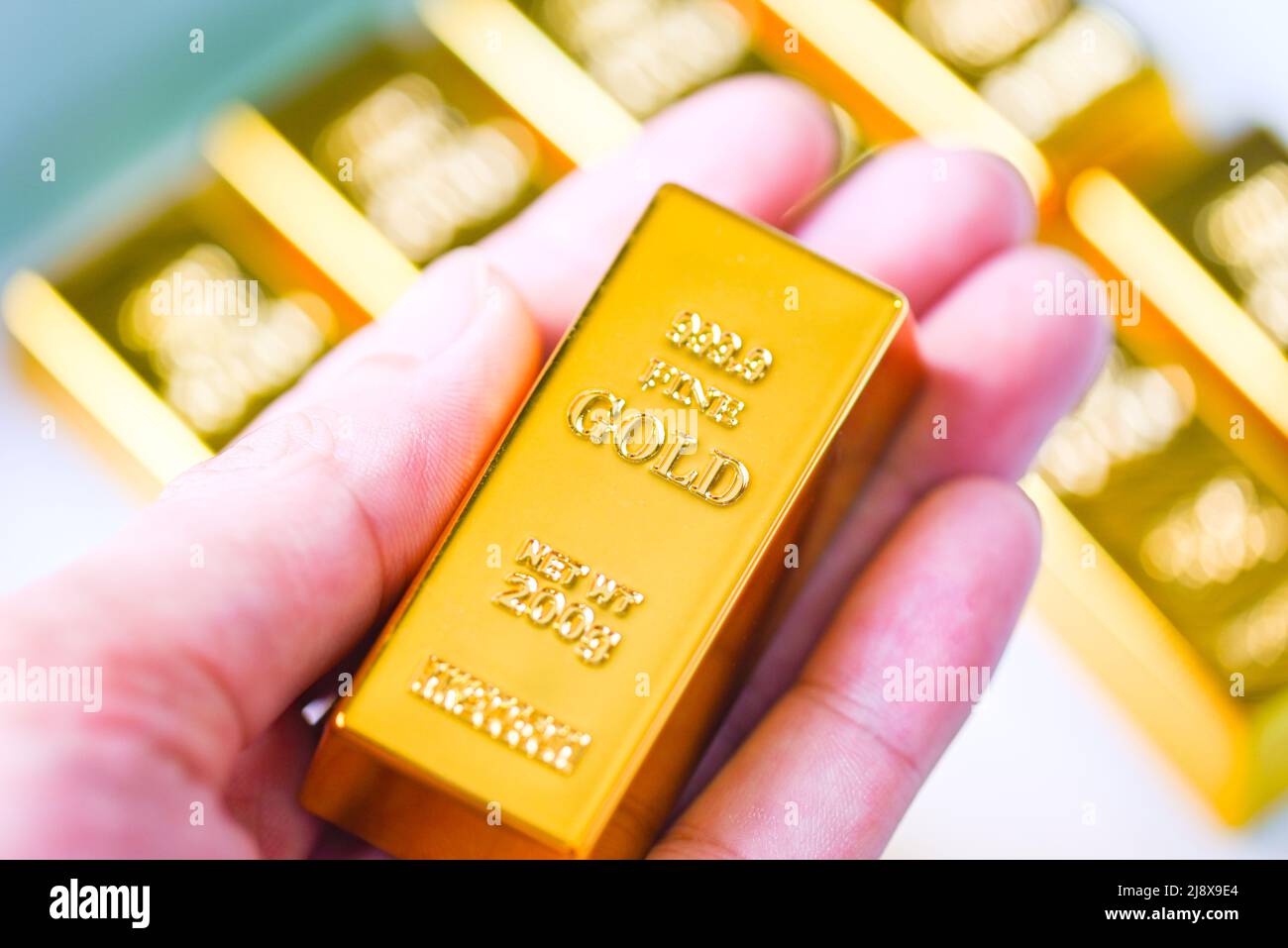 Gold bars in hand, Stack of gold bars financial business economy concepts, wealth and reserve
