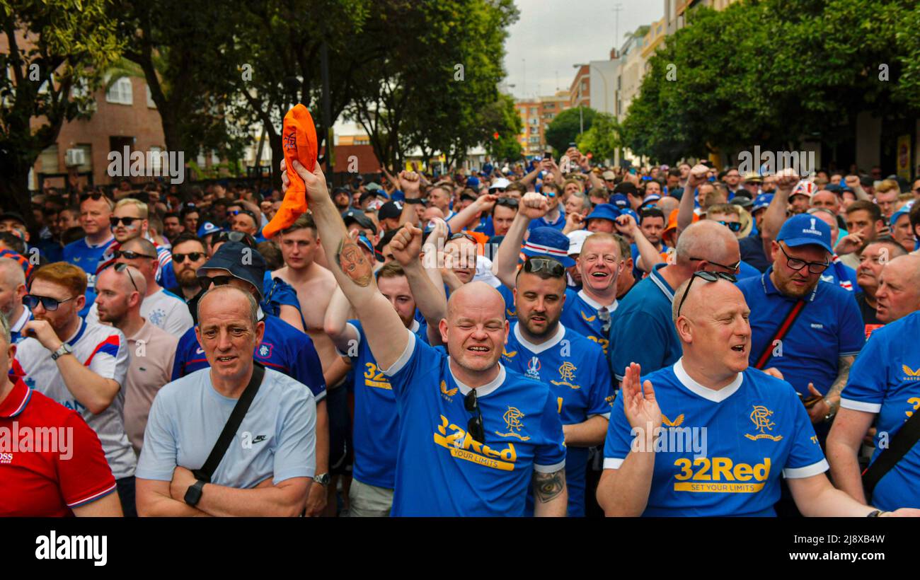 Seville, Spain. 18th May, 2022. Glasgow Rangers fans sing songs as they walk to the stadium