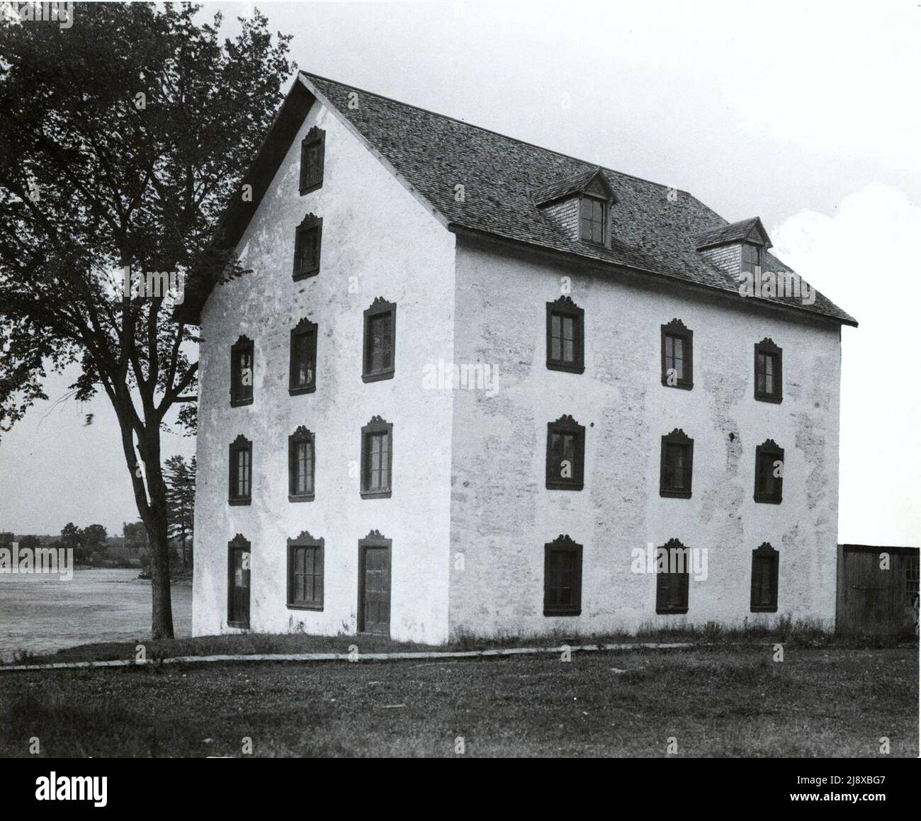 Photograph of the old bakery located in Terrebonne. You can see the Rivière des Mille Îles in the background  ca.  1940 Stock Photo