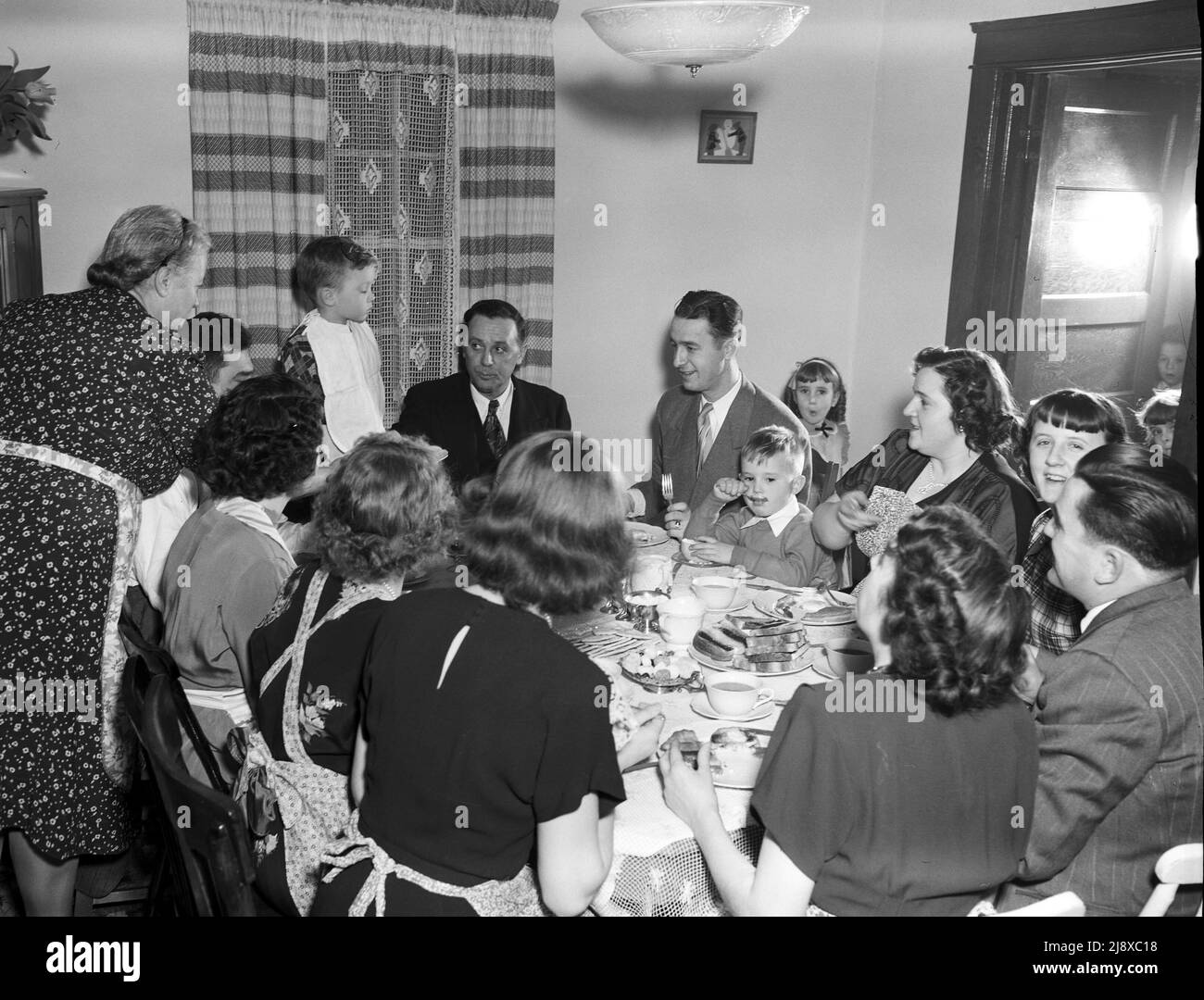 Family meal in a Quebec family home ca. 1949 Stock Photo Alamy