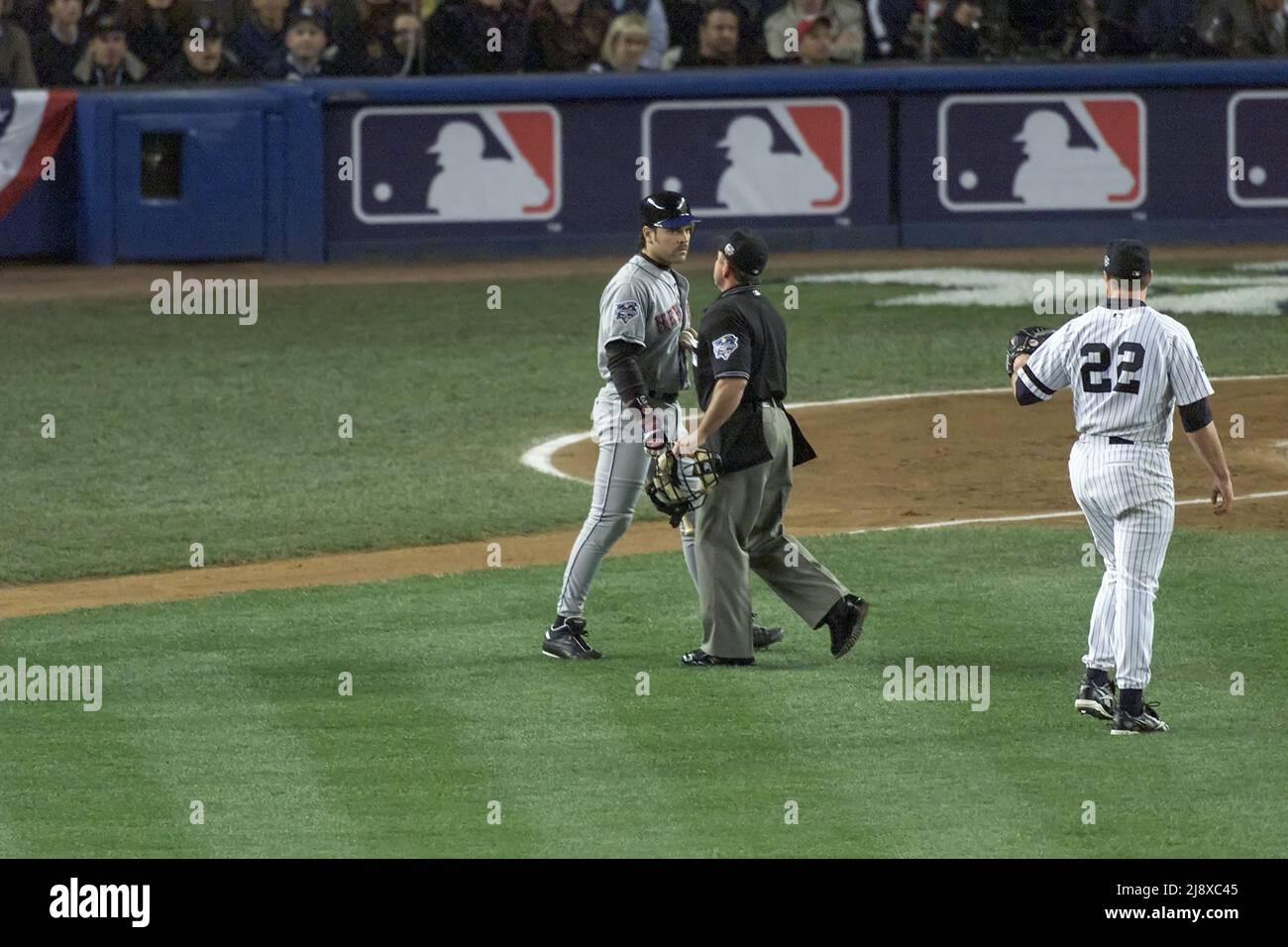 New York Mets batter Mike Piazza, left, confronts New York Yankees pitcher Roger Clemens after he threw a bat  during World Series Game 1 at Yankees Stadium in New York on October 22, 2000. Home plate umpire Charlie Reliford is shown in the middle. Photo by Francis Specker Stock Photo
