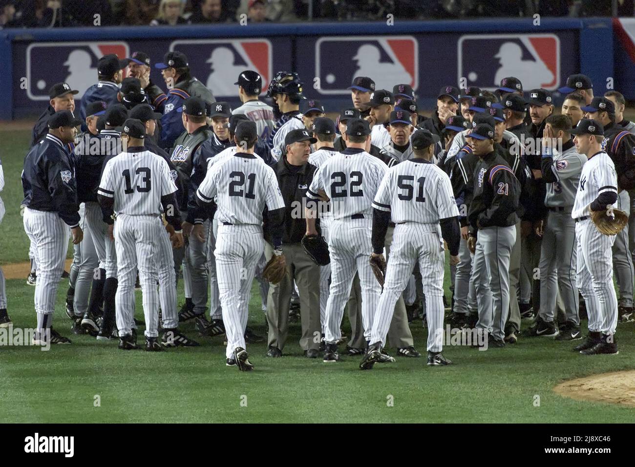 New York Yankees and New York Mets players confront each other after New York Yankees pitcher Roger Clemens threw a bat at New York Mets batter Mike Piazza during World Series Game 1 at Yankees Stadium in New York on October 22, 2000. Photo by Francis Specker Stock Photo