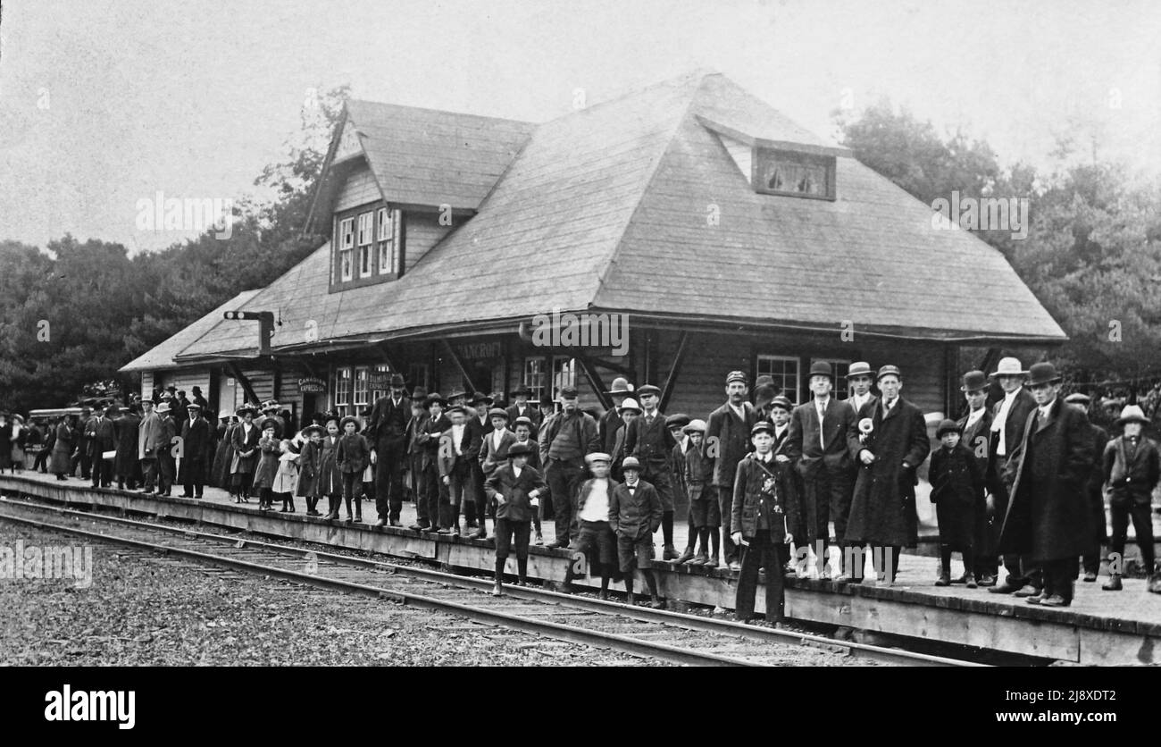 A crowd gathers on the Central Ontario Railway platform in Bancroft to await the arrival of the first train to that city  ca.  1900 Stock Photo