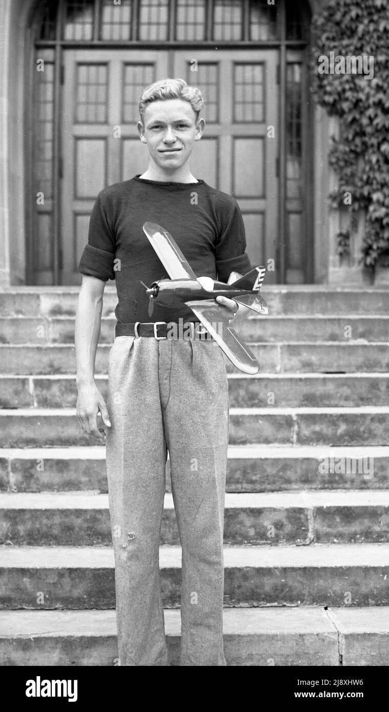 Young man holding a toy plane in late 1930s Stock Photo