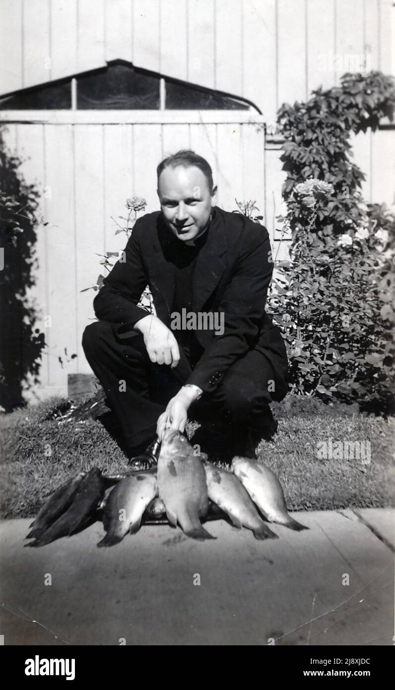 Father Tom Mooney enjoyed fishing  ca.  1928 Stock Photo