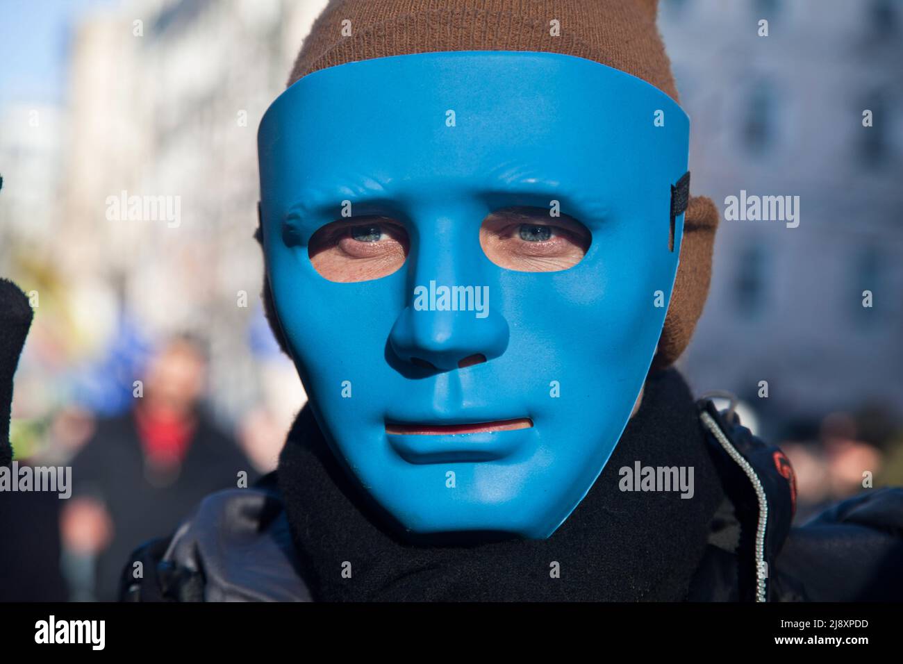 Kyiv, Ukraine. 18th Feb, 2014. A masked protester stands in a crowd during the demonstration. A protest against the Ukrainian government's decision not to sign the European Union Association Agreement instead of the government choosing closer ties with Russia. Protesters opposed widespread corruption and called for the resignation of Ukrainian President Viktor Yanukovych. (Photo by Joe M O'Brien/SOPA Images/Sipa USA) Credit: Sipa USA/Alamy Live News Stock Photo