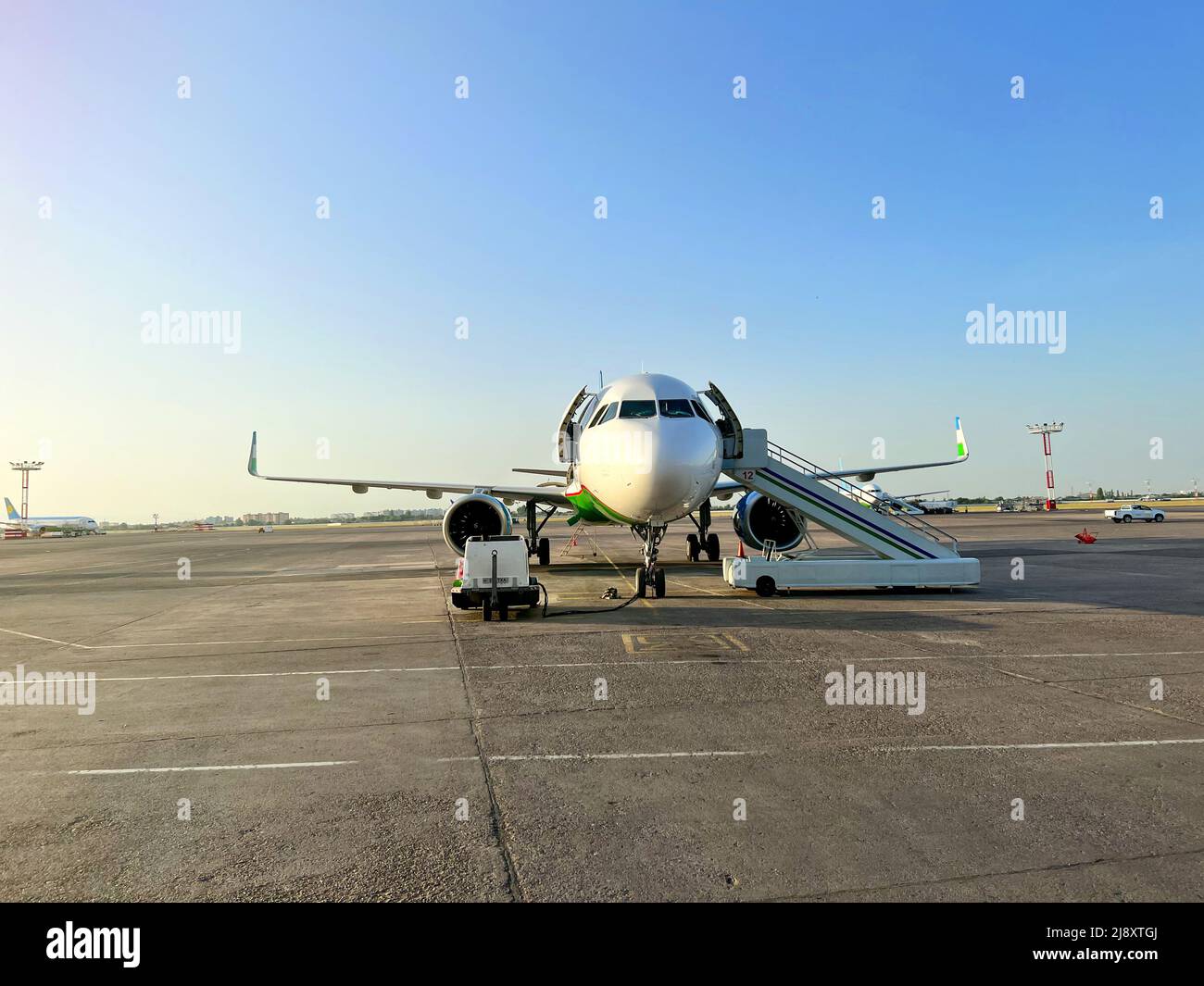 passenger plane is parked at the airport Stock Photo