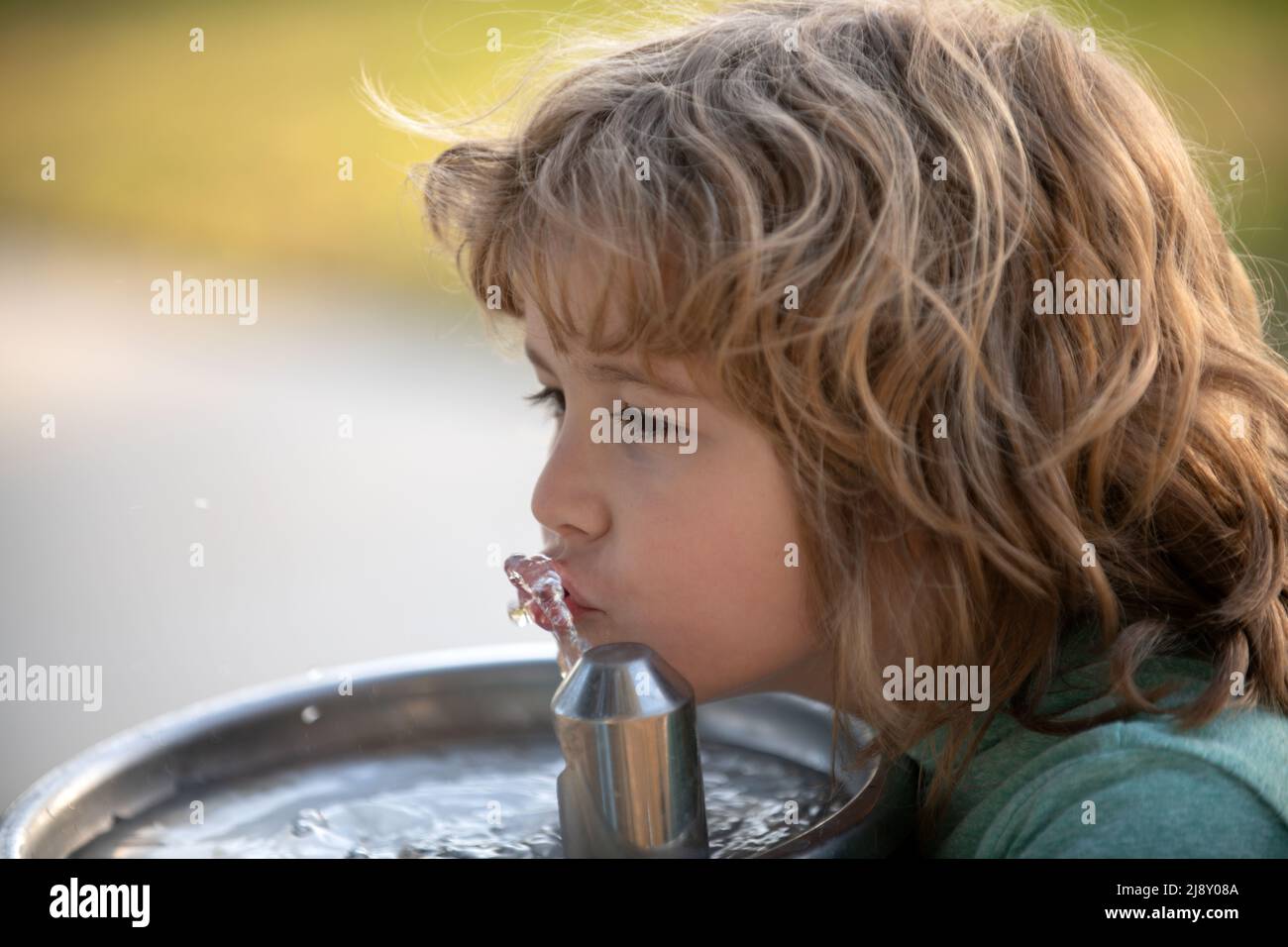 Teen boy drinking water hi-res stock photography and images - Alamy
