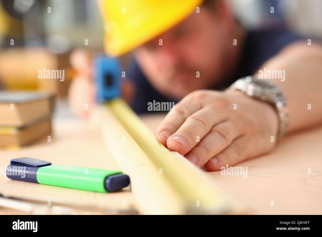 Male measuring wooden bar with equipment, manual job, diy inspiration