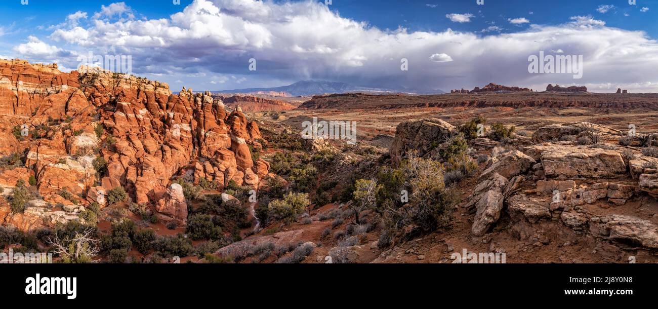 A late afternoon panoramic view of the Fiery Furnace, the Salt Valley and the La Sal Mountains in Arches National Park in Moab, Utah. Stock Photo