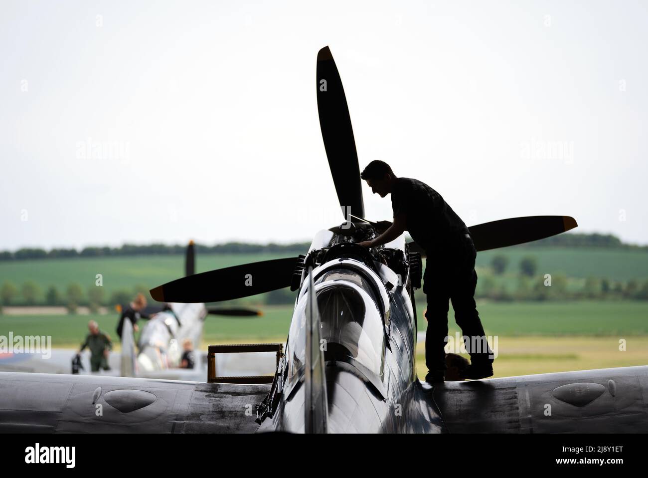 Aircraft Restoration Company engineers carry out maintenance on a Supermarine Spitfire at IWM Duxford in preparation for the Duxford Summer Air Show. Picture date: Wednesday May 18, 2022. Stock Photo