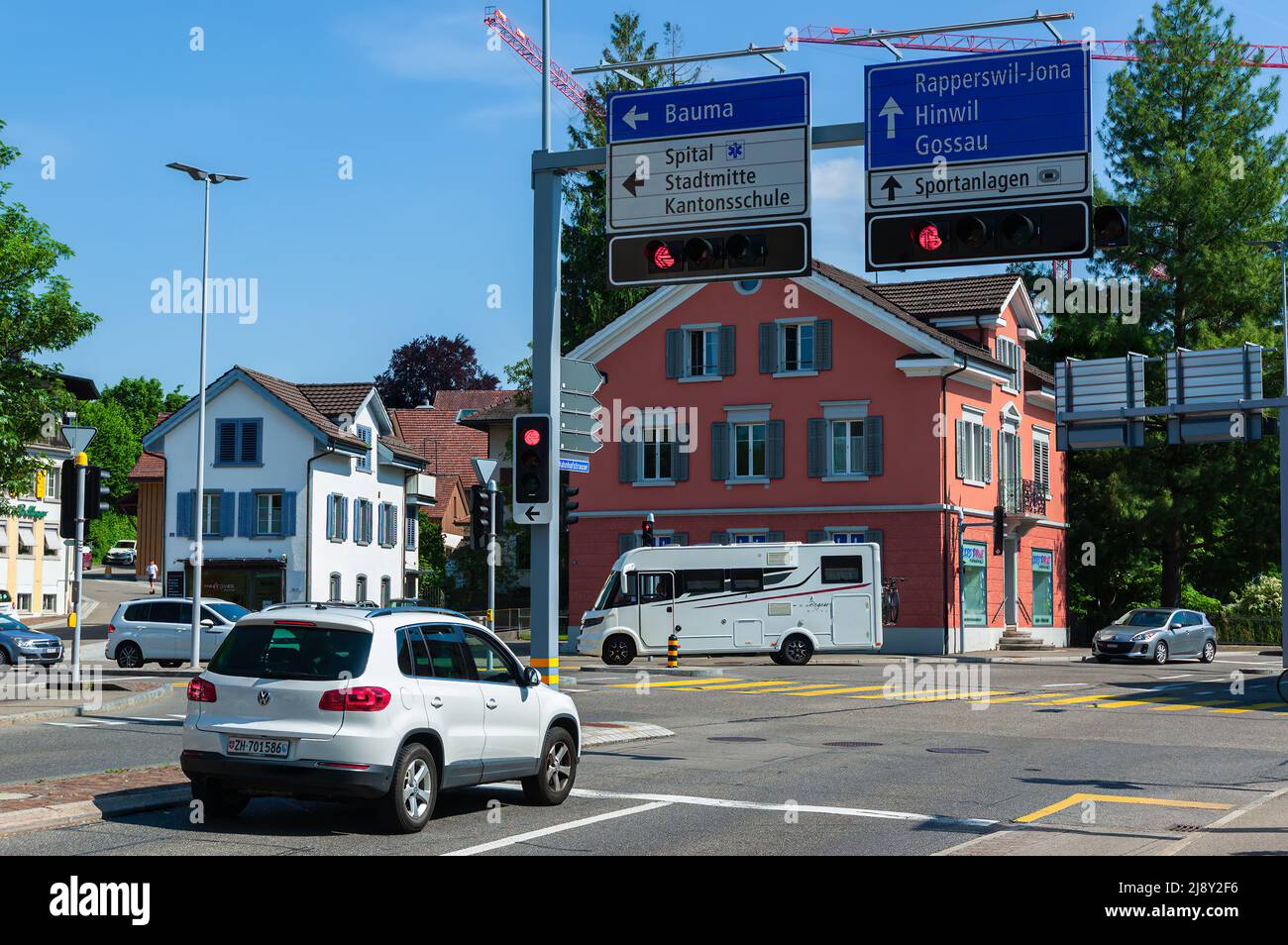 Wetzikon, Switzerland - May 14, 2022: Traffic junction in Wetzikon, Switzerland. Traffic directions for Bauma, Rapperswil, Hinwil, Gossau ... Stock Photo