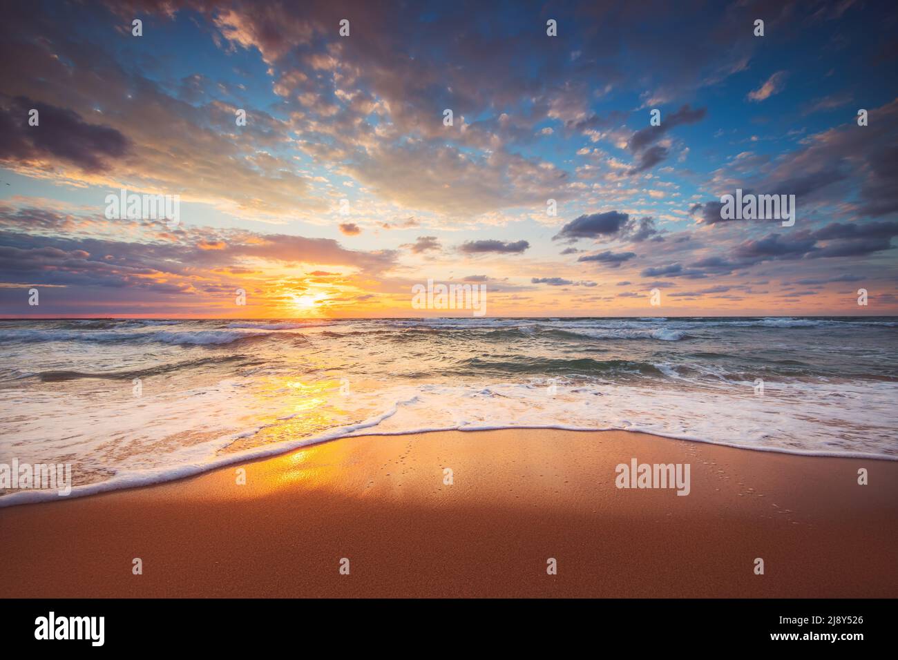 Beach sunrise over the tropical sea Stock Photo - Alamy