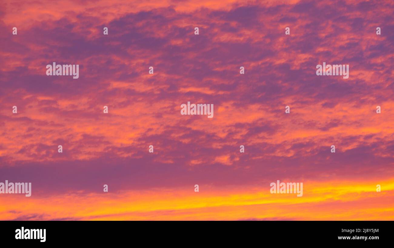 Background of orange and purple sky with clouds on sunset Stock Photo ...