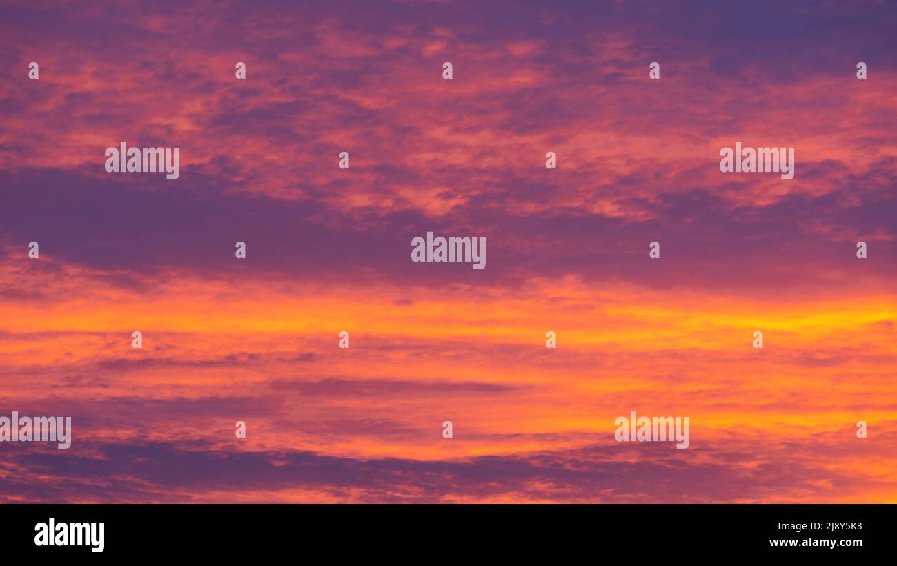 Background of orange and purple sky with clouds on sunset Stock Photo ...