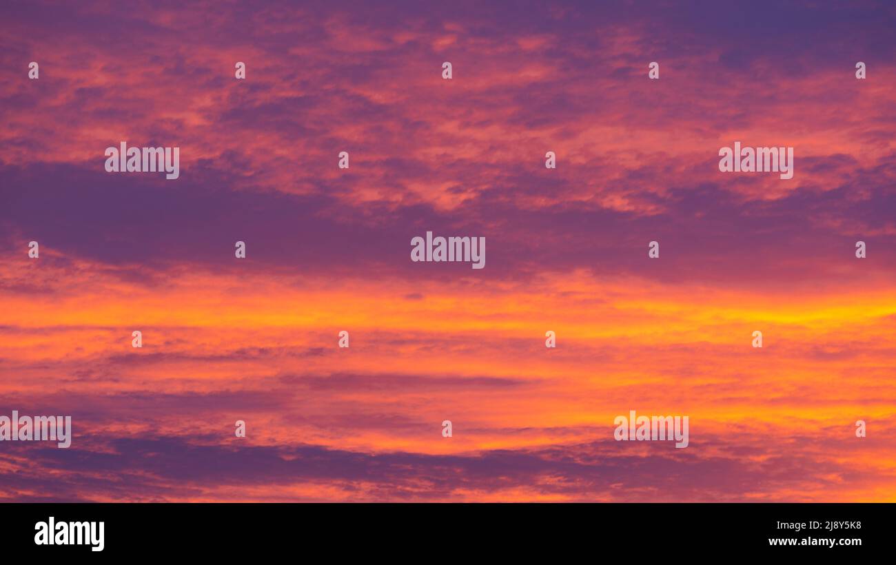 Background of orange and purple sky with clouds on sunset Stock Photo ...