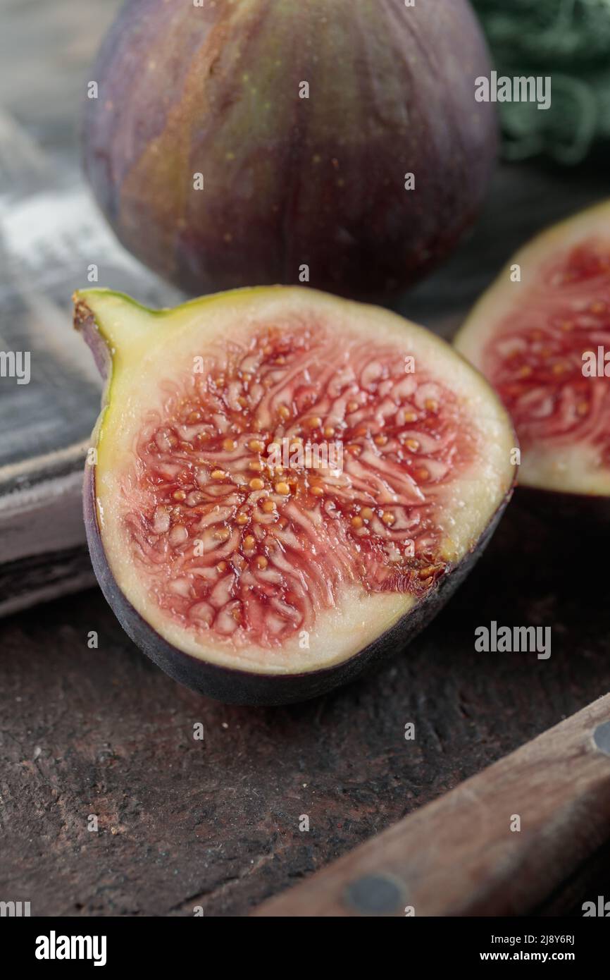 A Ripe Fig Ripe Figs on a dark table background Stock Photo - Alamy