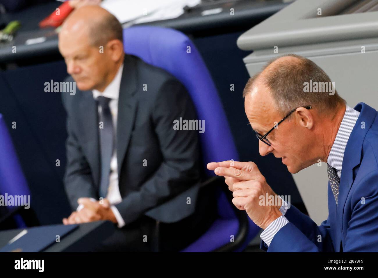 Leader of Germany's Christian Democratic Union (CDU) Friedrich Merz speaks as German Chancellor Olaf Scholz listens during a session of Germany's lower house of parliament, the Bundestag, in Berlin, Germany, May 19, 2022. REUTERS/Hannibal Hanschke Stock Photo