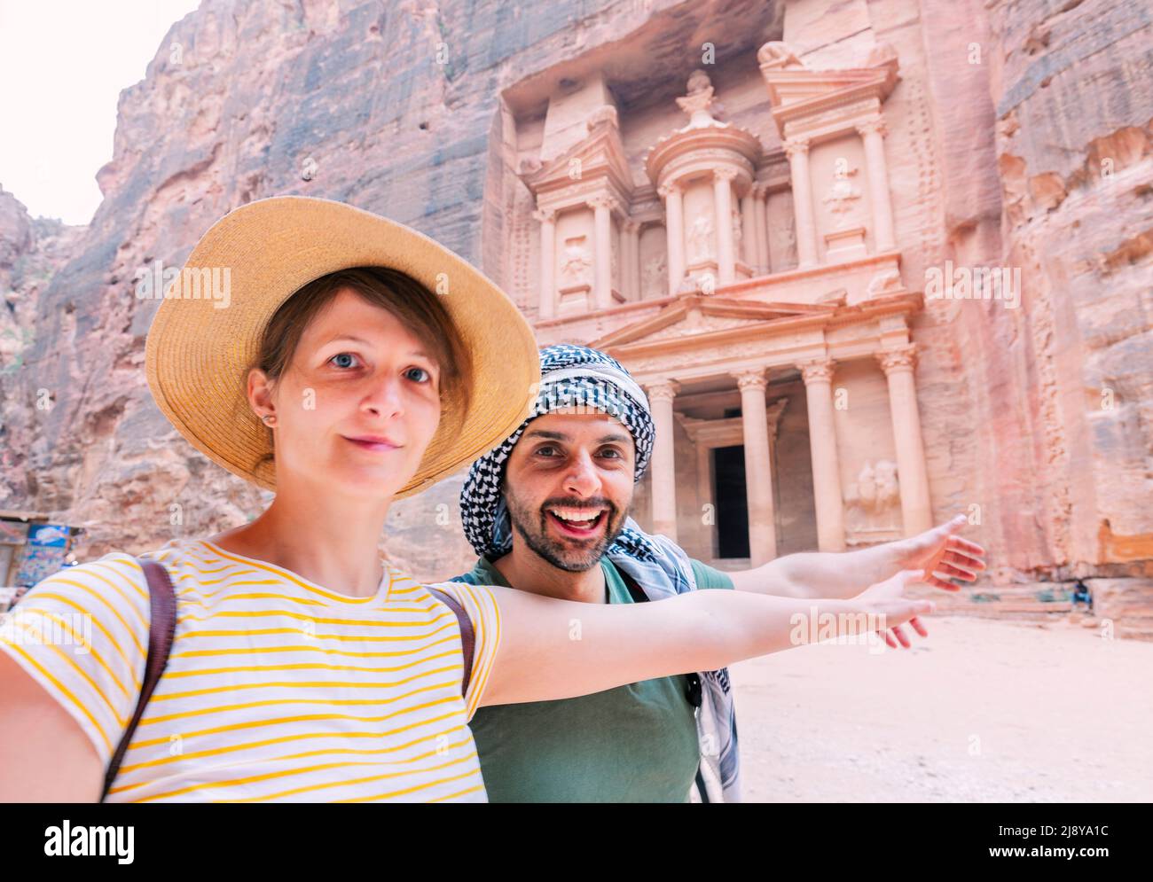 Young Couple taking selfie photo in front of the treasury of petra, jordan Stock Photo