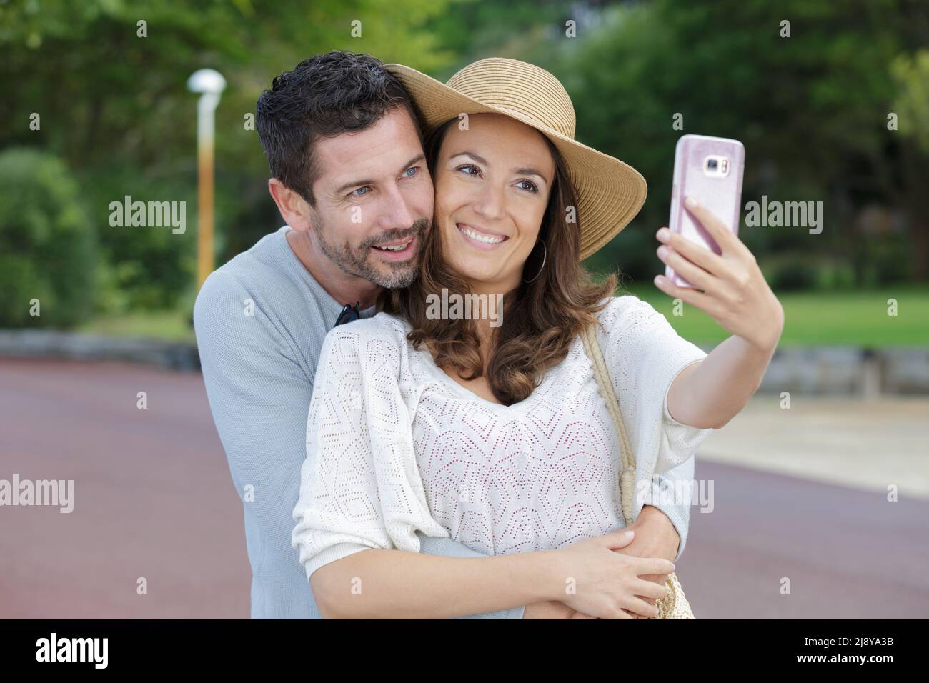man and woman in a wheelchair talking a selfie Stock Photo - Alamy