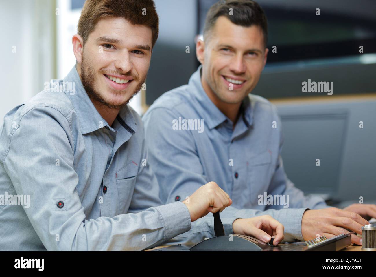 two architects discussing blueprints in the office Stock Photo