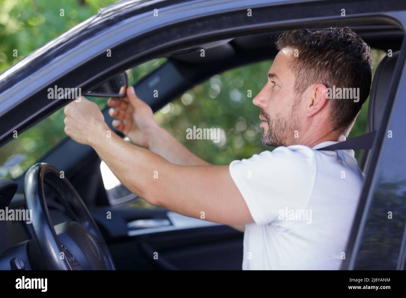 Man adjusting steering wheel hi-res stock photography and images - Alamy