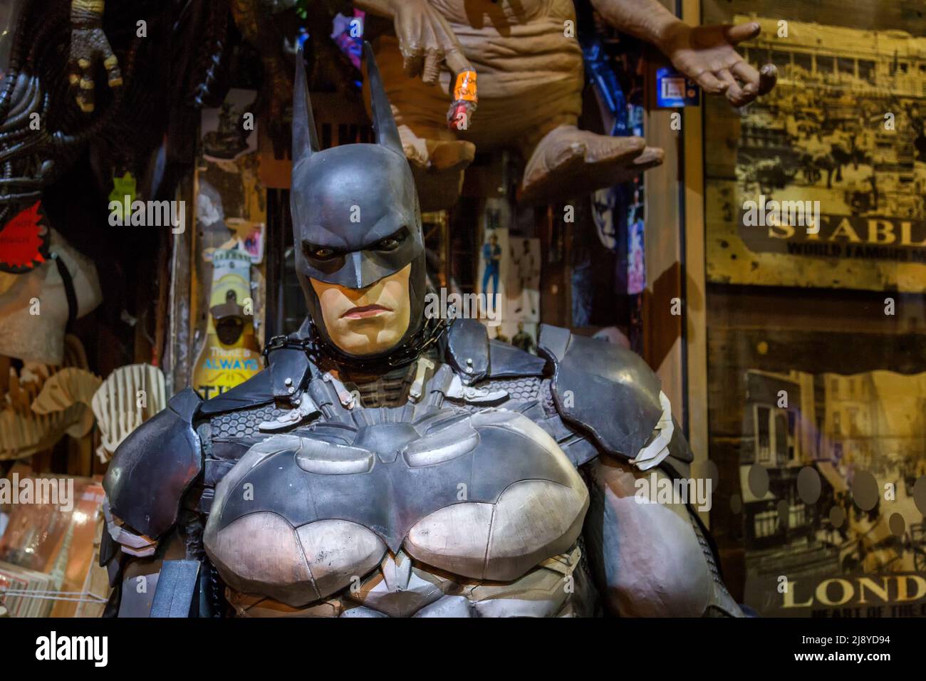A life size mannequin of Batman showing off his muscular physique. Perhaps offering conceptual use for fitness, diet, masculinity, bodybuilding etc. Stock Photo