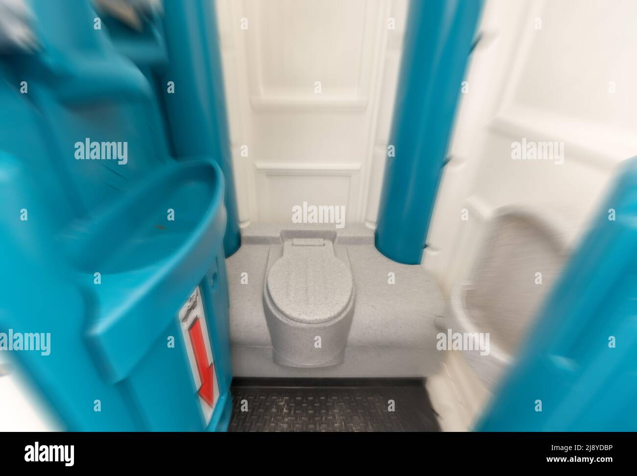 Disgust at public toilets shown with a mobile toilet cabin Stock Photo