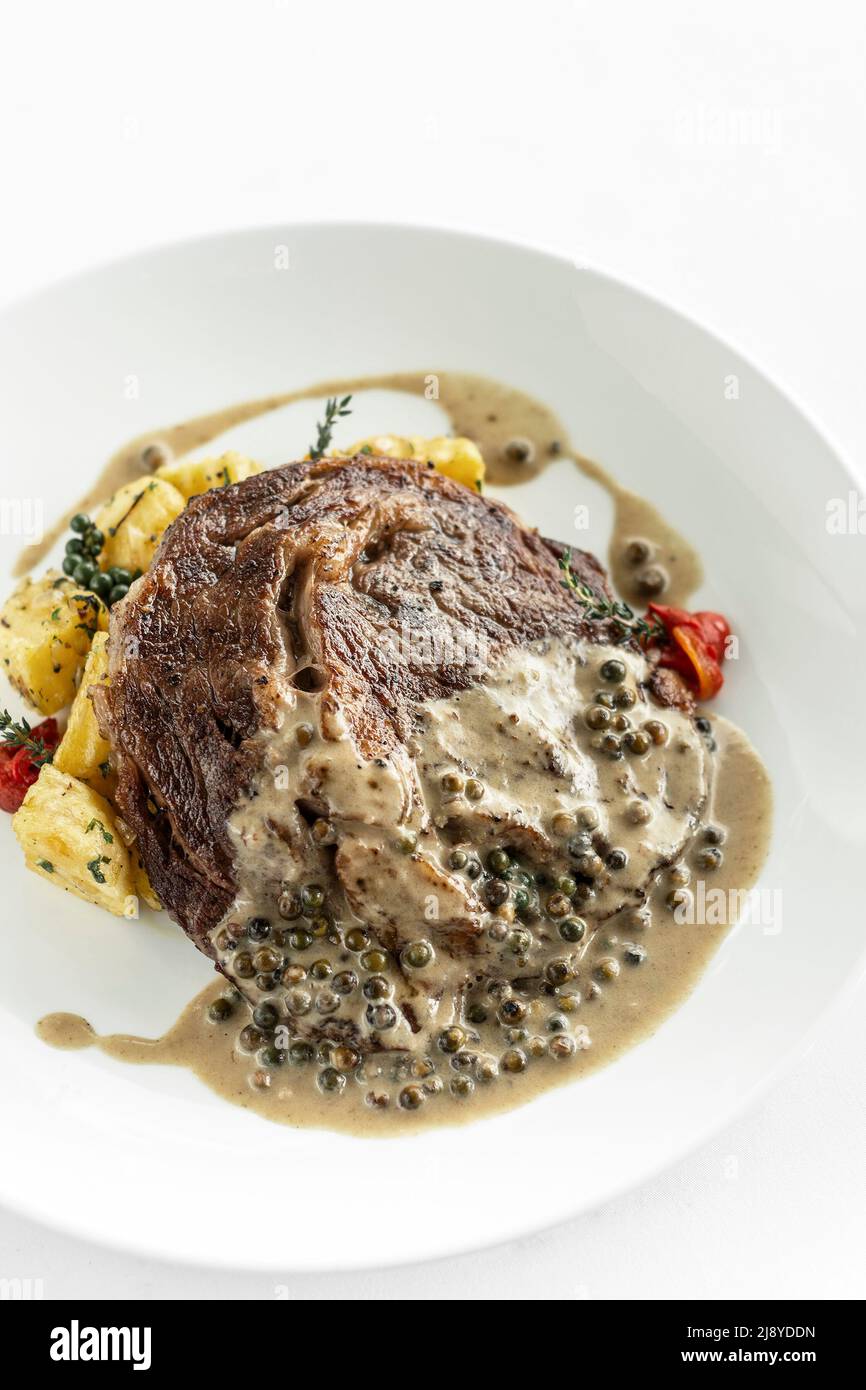 rib eye beef steak with creamy peppercorn sauce Stock Photo Alamy