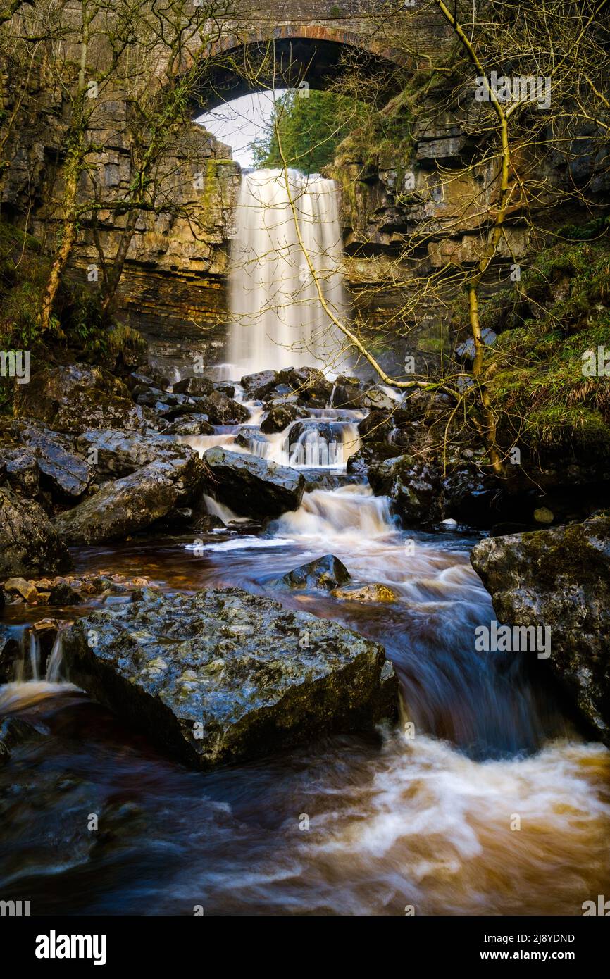 Ashgill Force waterfall, under a road bridge near Alston, Cumbria, UK Stock Photo