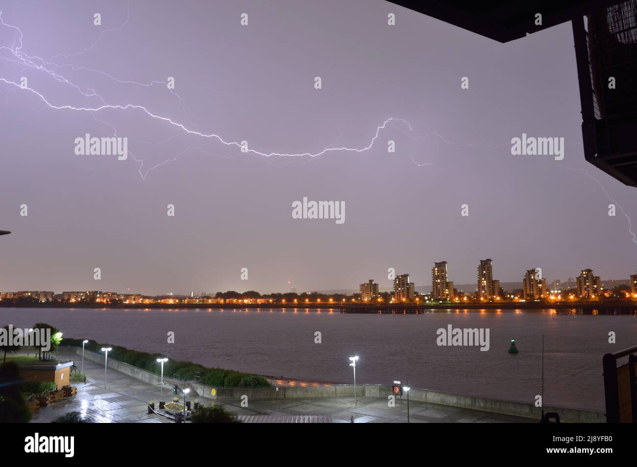Night time lightning storm seen over the River Thames in London on a May evening Stock Photo