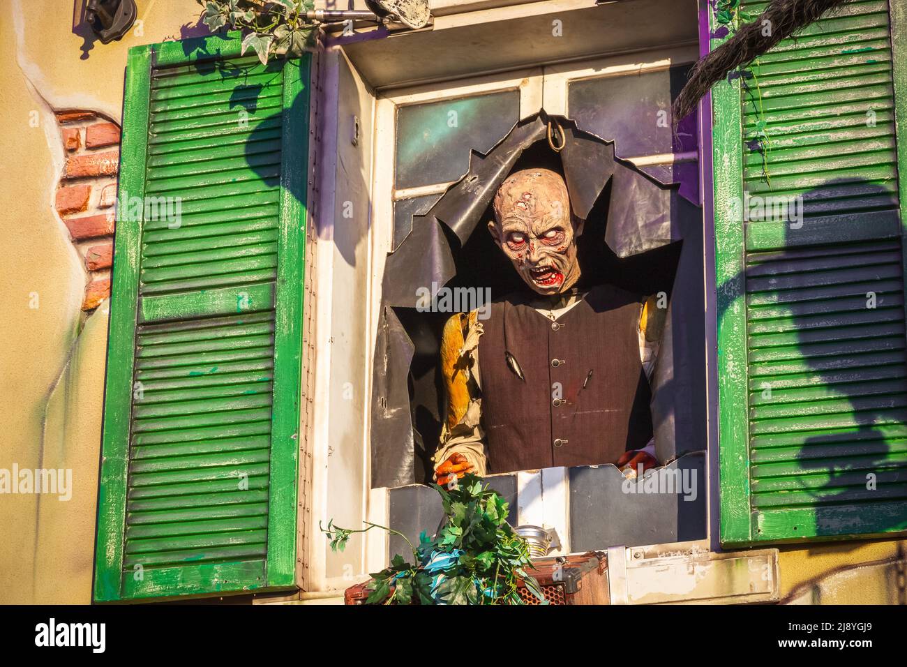 A horror character outside haunted attraction at Christmas funfair Hyde Park Winter Wonderland of London Stock Photo