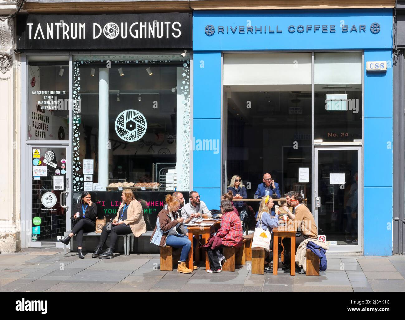 Customers sitting outside cafes in Glasgow city centre, enjoying the warm sunny weather, Glasgow, Scotland, UK Stock Photo