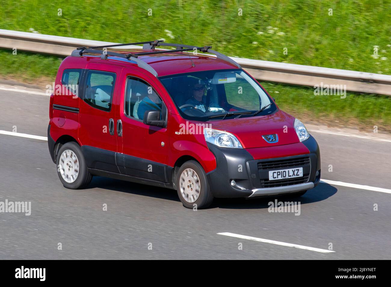 2010 red PEUGEOT Bipper HDI Tepee Outdoor 1399cc Diesel 4dr Stock Photo