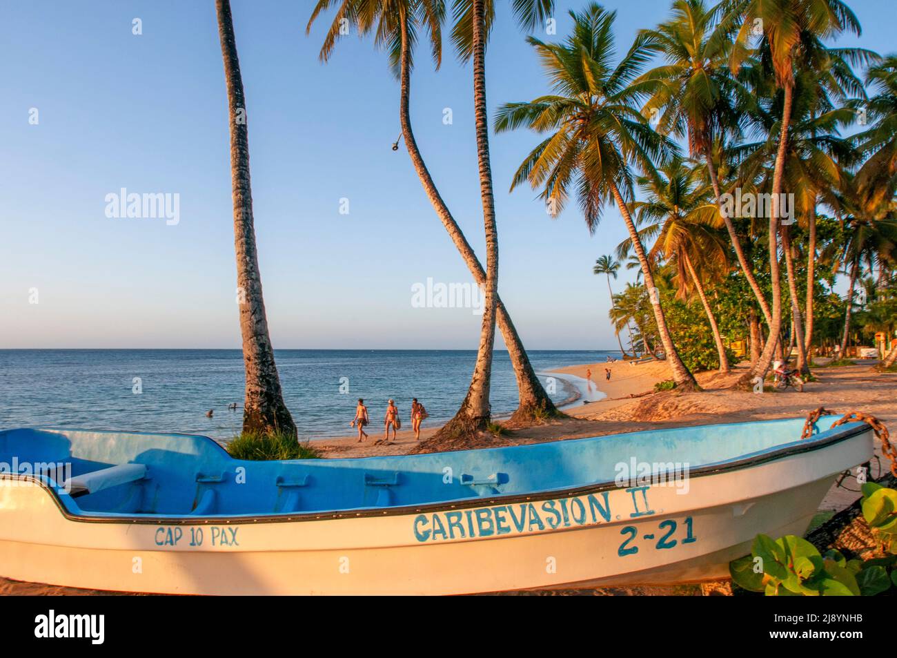 Tourists and fishers boats in Las Terrenas beach, Samana, Dominican Republic, Carribean, America