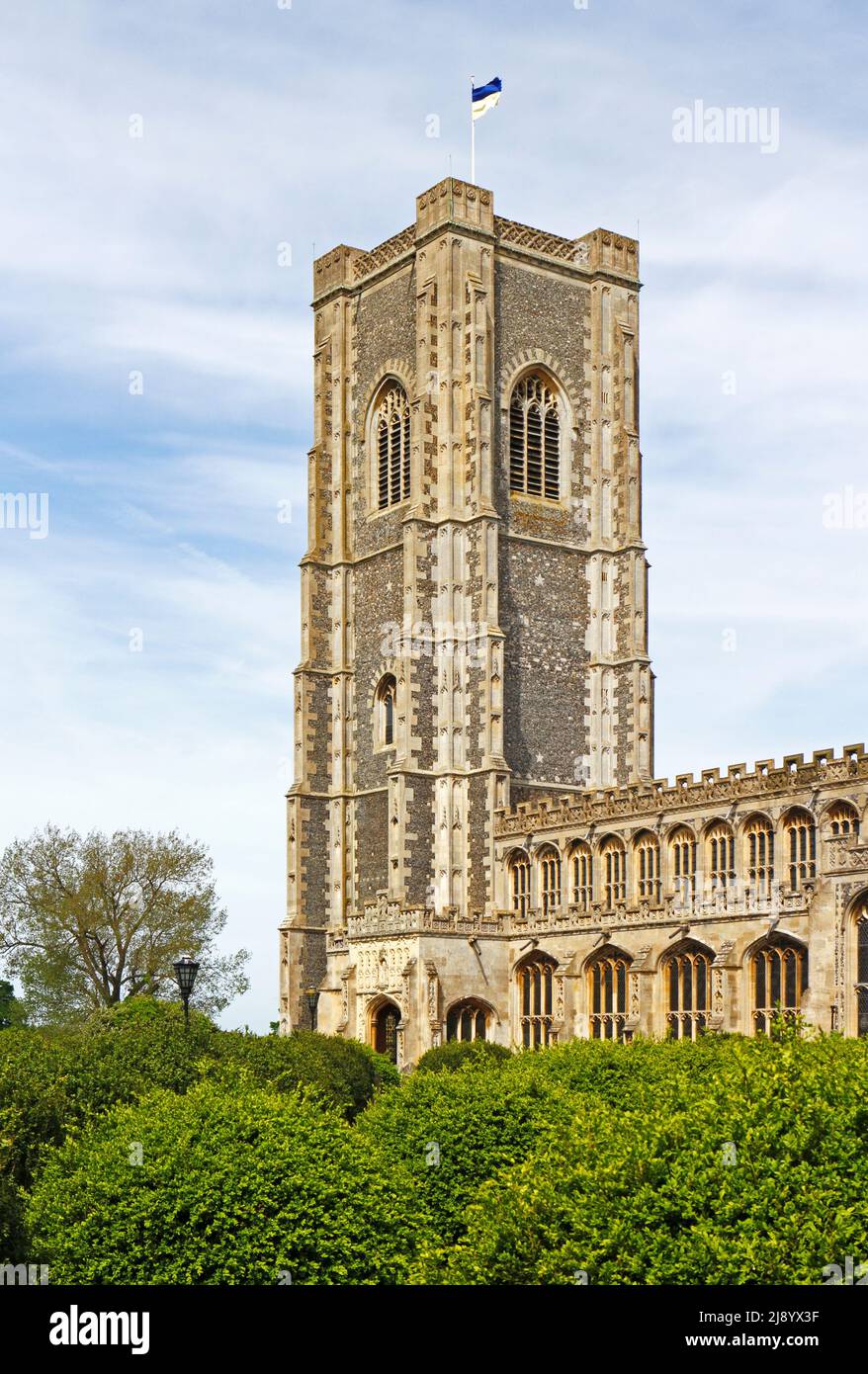 A view of the lofty tower and south porch of the parish Church of St Peter and St Paul in the village of Lavenham, Suffolk, England, United Kingdom. Stock Photo