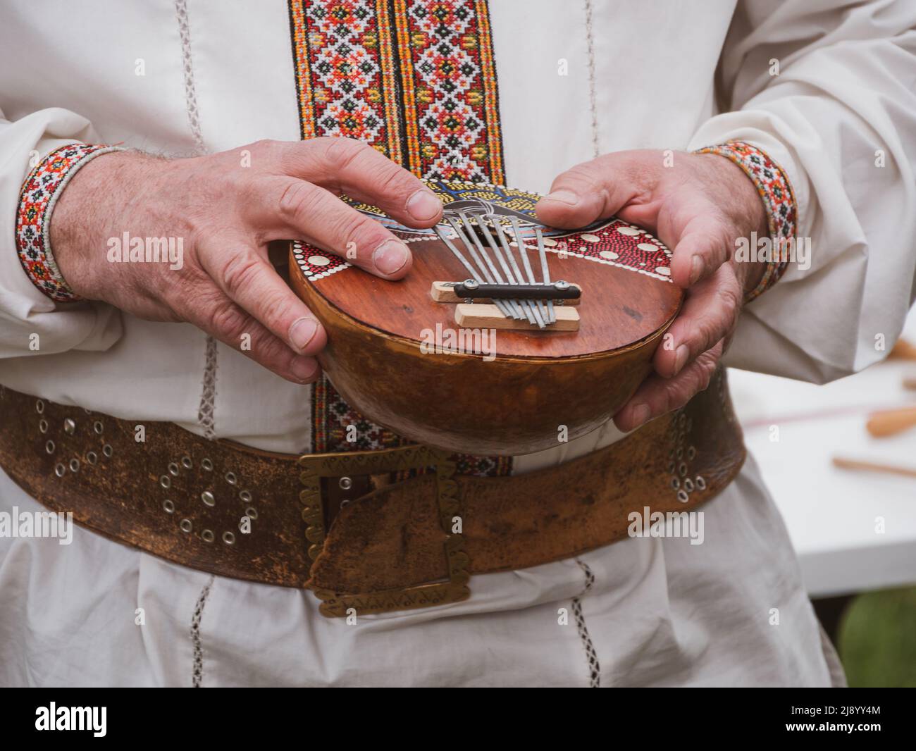 Musician plying mbira ethnic musical instrument. Ukraininan kalimba, finger  harp, gourd piano, ikembe. Classification Lamellophone, Plucked Idiophone  Stock Photo - Alamy