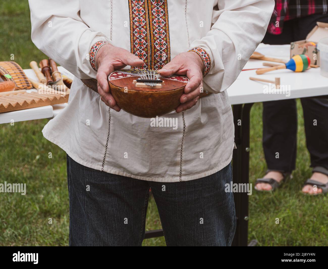 Musician plying mbira ethnic musical instrument. Ukraininan kalimba