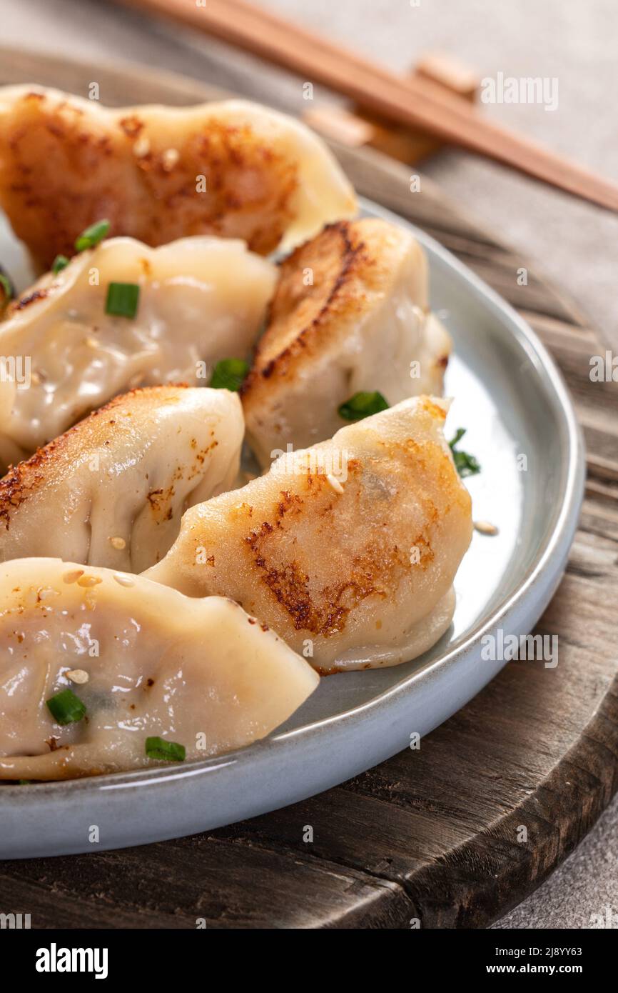 Taiwanese and Japanese Panfried gyoza dumpling jiaozi food in a plate