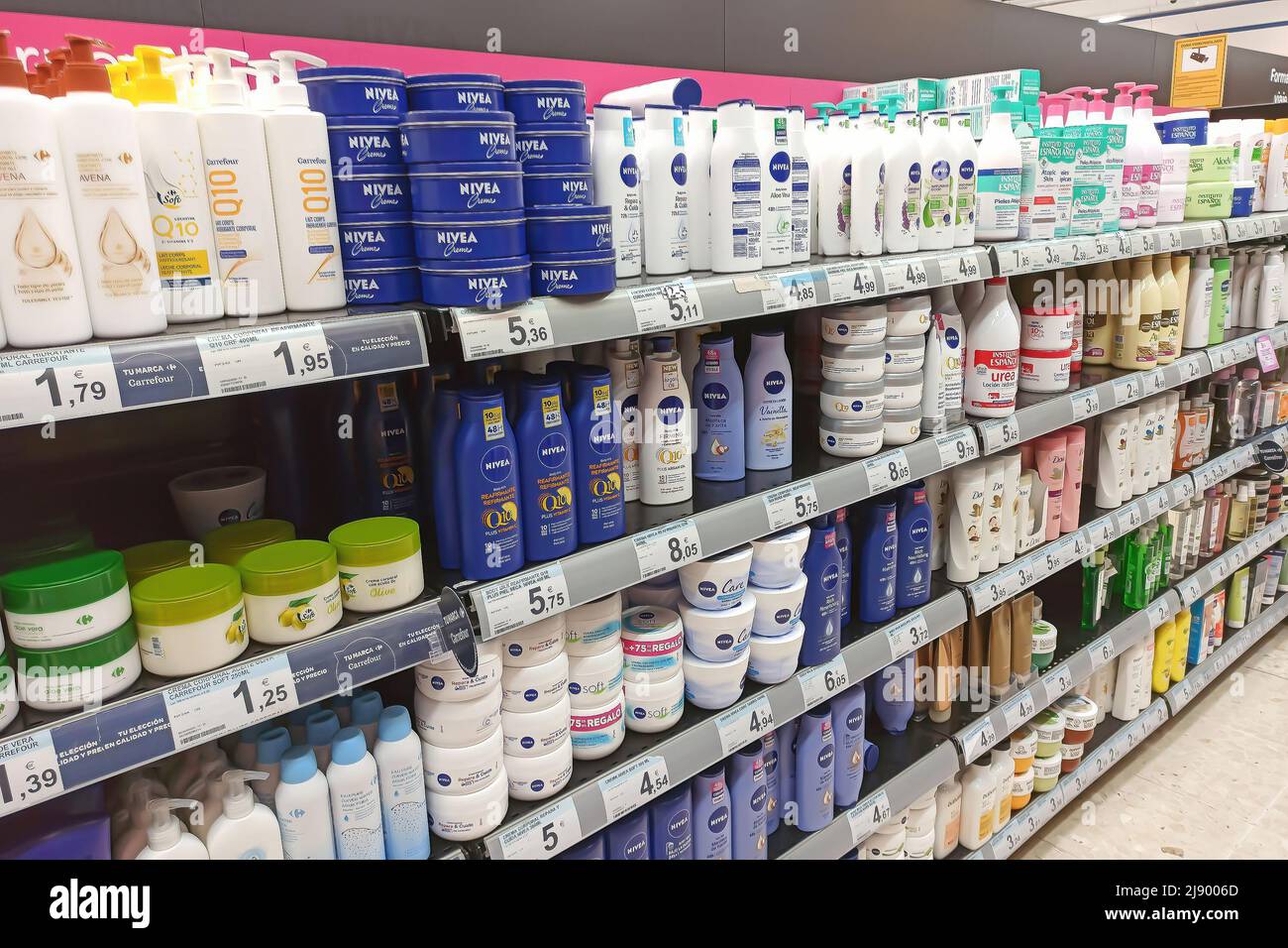 Huelva, Spain - May 10, 2022: Nivea body Milk bottles in a Shelf of a supermarket Stock Photo