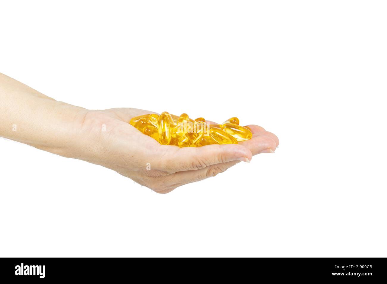 Woman's Hand holding Omega 3 capsules isolated on white background with space for text Stock Photo