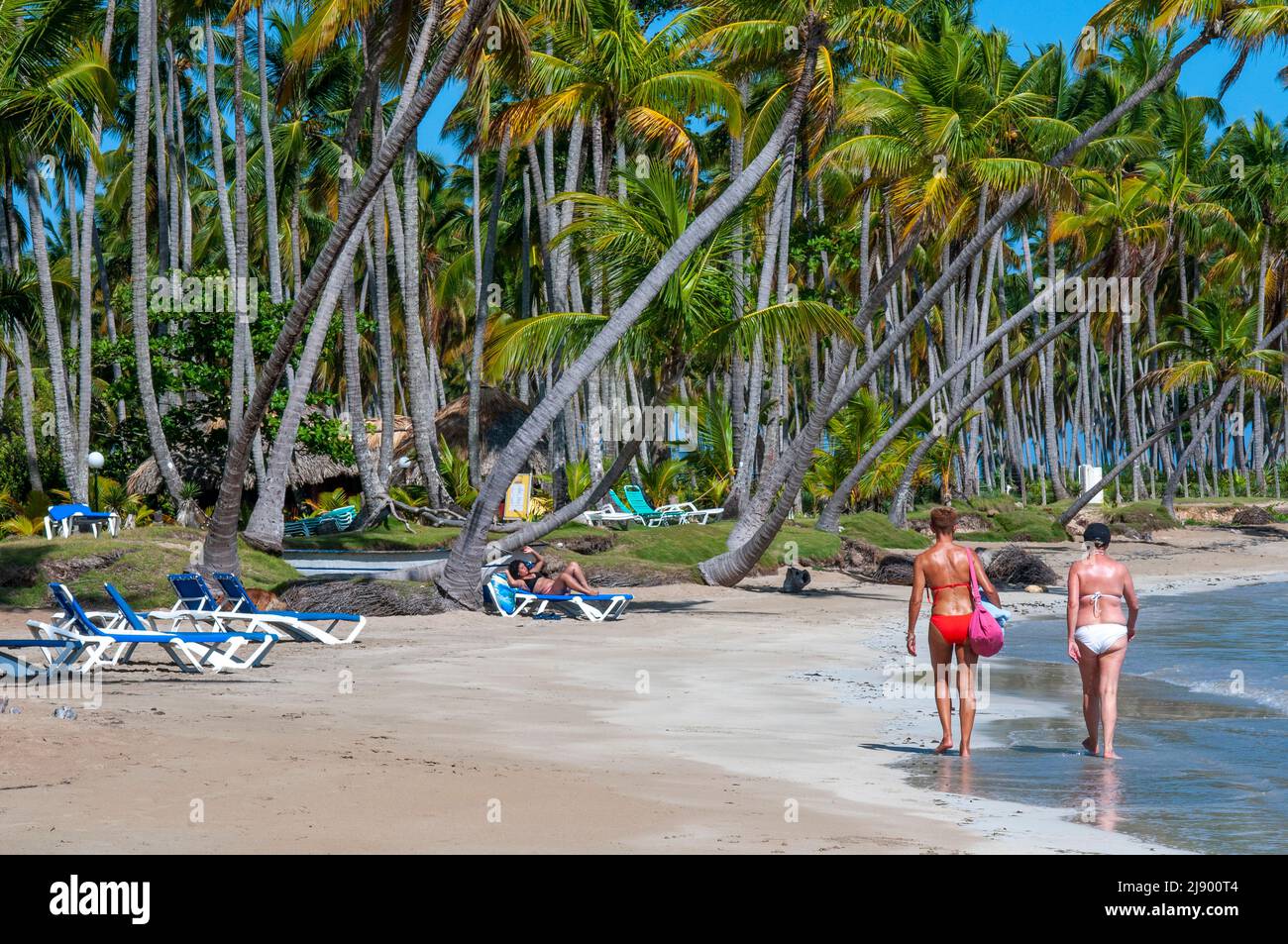 Tourists girls in playa bonita beach on the Samana peninsula in Dominican Republic near the Las Terrenas town.   Playa Bonita, as its name suggests, i Stock Photo