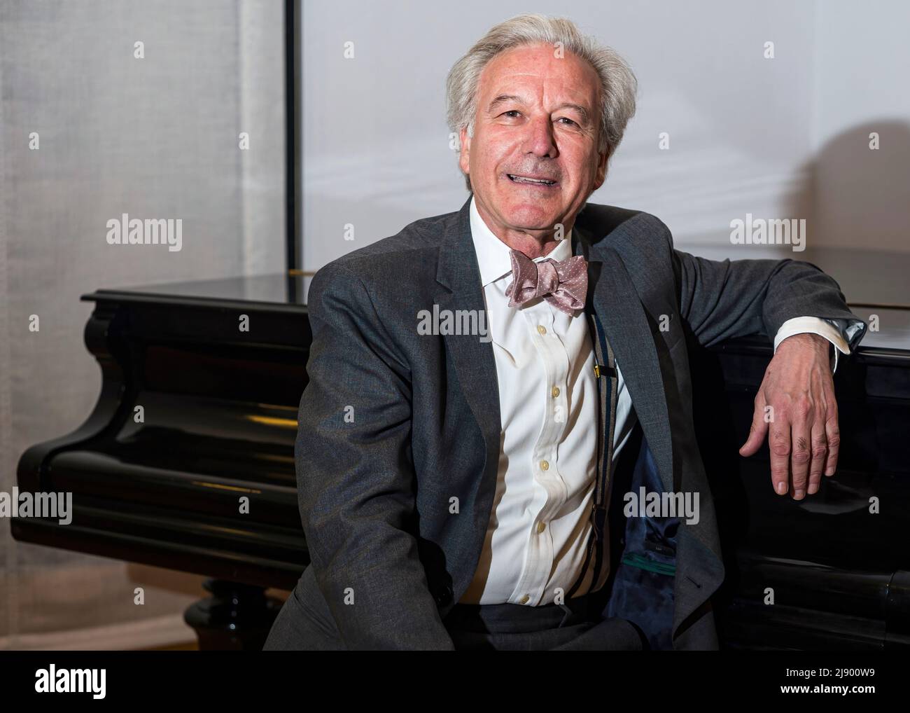 Portrait of Spanish-born American conductor Angel Gil co-founded the PostClassical Ensemble with music historian Joseph Horowitz. Medium shot seated w Stock Photo