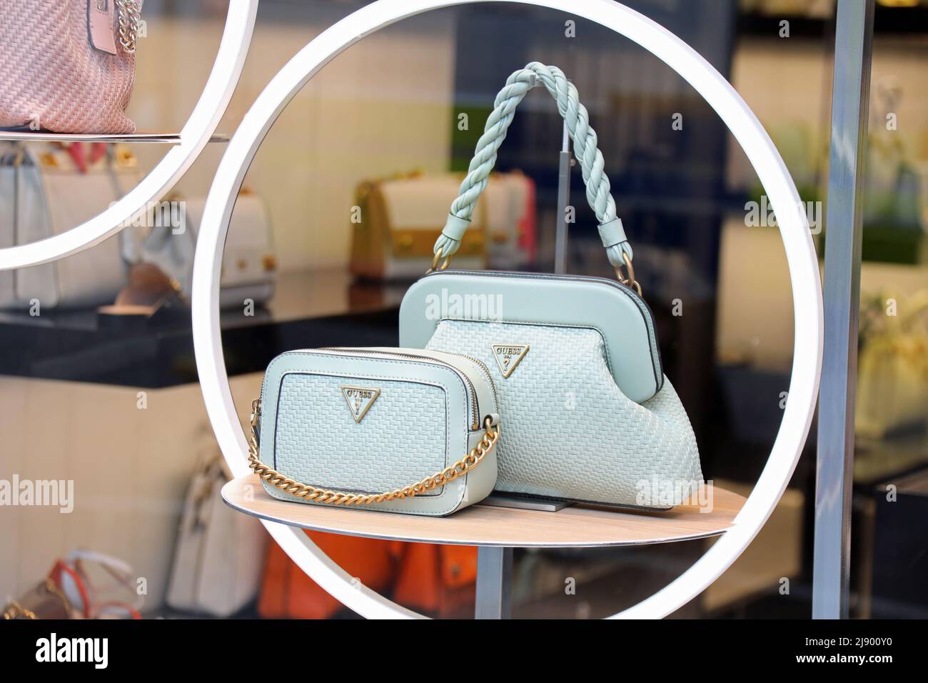 Guess bags in a shop window Stock Photo - Alamy
